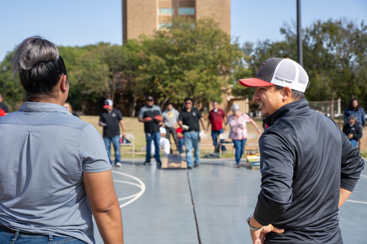 Tournament player holding cornhole bags at the SECC cornhole competition before a throw